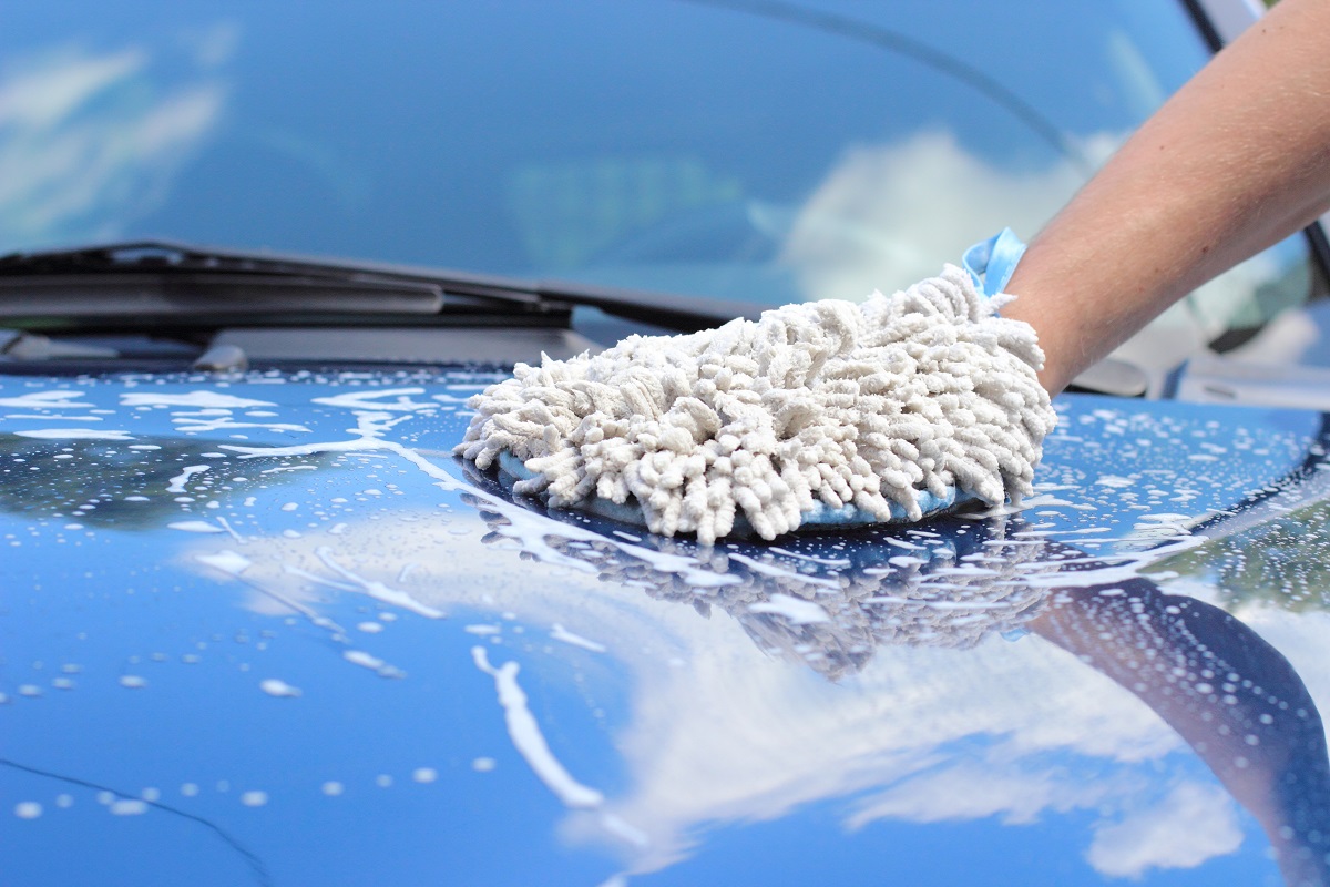 A person washing a car